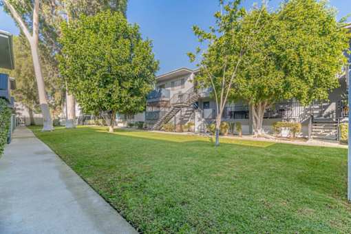 apartment community with grass and trees at BLVD Apartments LLC, Tarzana, CA 91356