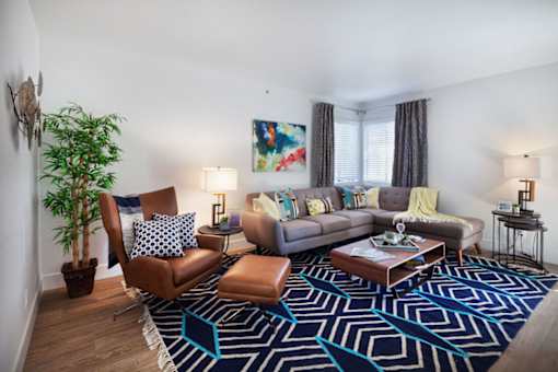 furnished living room with couches and chairs at the adelaideelaide apartmentsat The Bryant, Yorba Linda, 92887