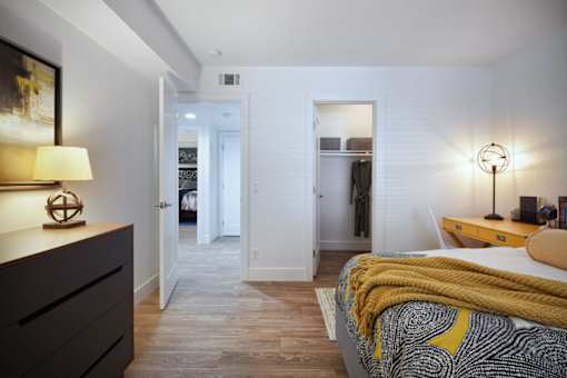 a bedroom with a bed and a closetat The Bryant, California