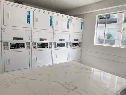 a bunch of white appliances in a room at Latitude Apartments at Mission Valley, San Diego