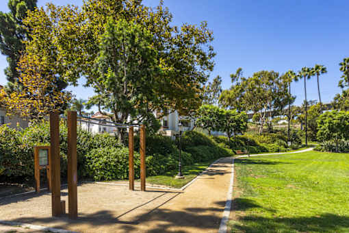 a path leading to a park with trees and grass at La Jolla Blue, California