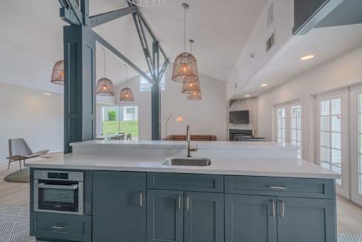 a large kitchen with blue cabinets and a white counter top at Napa Green Apartments LLC, Napa