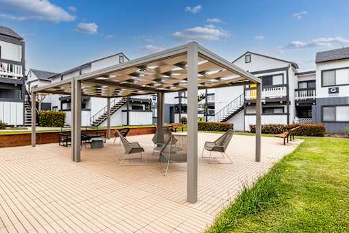Seating in outdoor area at The Gates at the Marina Apartments, Marina, CA