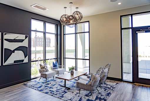 A modern living room with a large window and a view of the street.