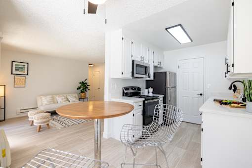 a living room with a kitchen and a dining table at Campbell West Apartments, Campbell, 95008