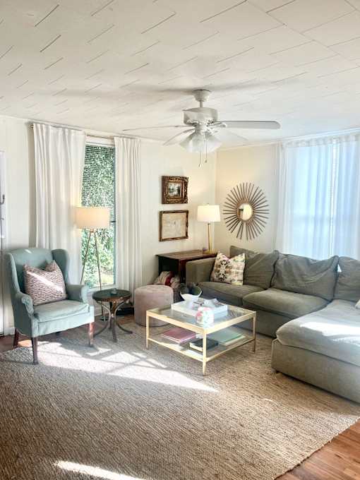 a living room with couches and chairs and a coffee table