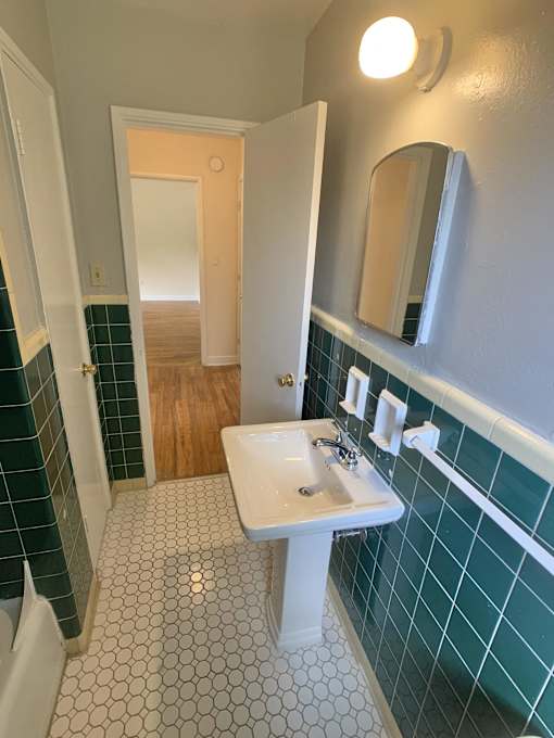 a bathroom with a sink and a mirror