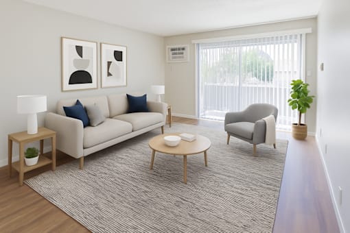 A living room with a couch, chair, and table.