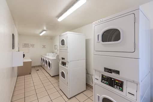 A row of washing machines in a laundromat.