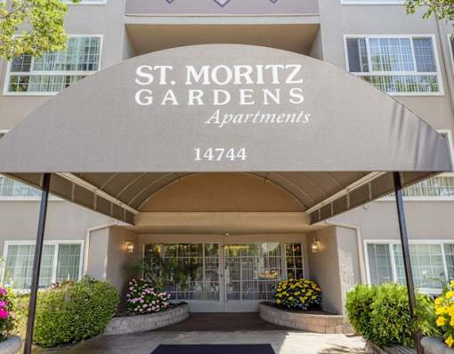 The front entrance of the St. Moritz Gardens Apartments is shown.