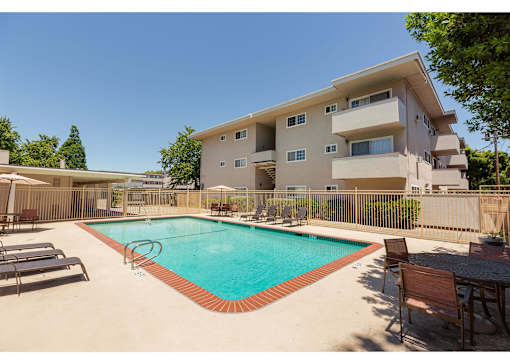 A large house with a pool in the backyard.