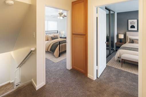 A bedroom with a bed and a dresser is shown.