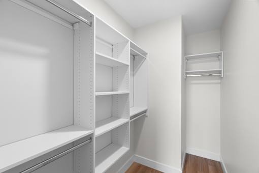 Empty white shelves in a room.