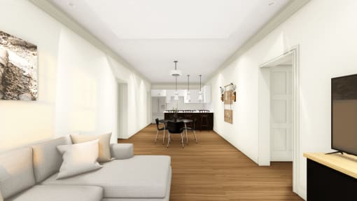 a view of a living room with a couch and a table with chairs