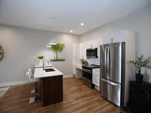 Kitchen with refrigerator and white countertop