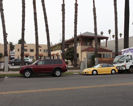 a group of cars parked on the side of a street