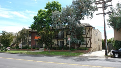 an apartment building on the corner of a street