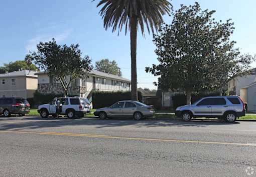 a group of cars parked on the side of a street