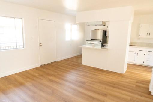 A kitchen area with a countertop and cabinets.