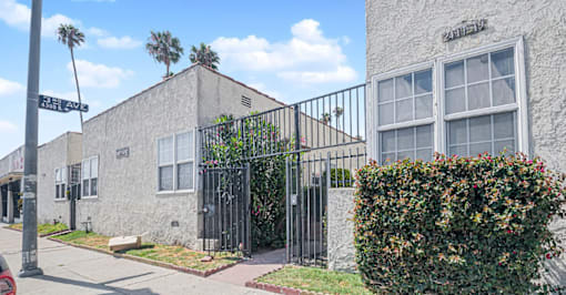 A street view of a building with a sign that reads "PATTISON ST".