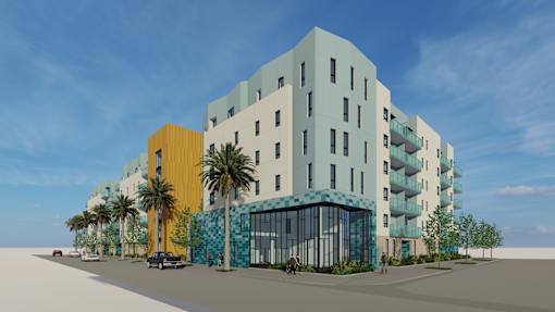 A modern multi-story building with a blue and yellow facade.