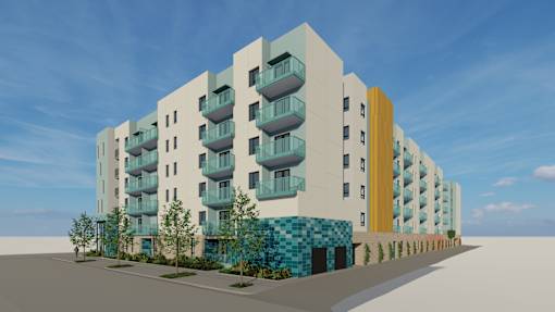 A modern apartment building with balconies and a blue and yellow facade.