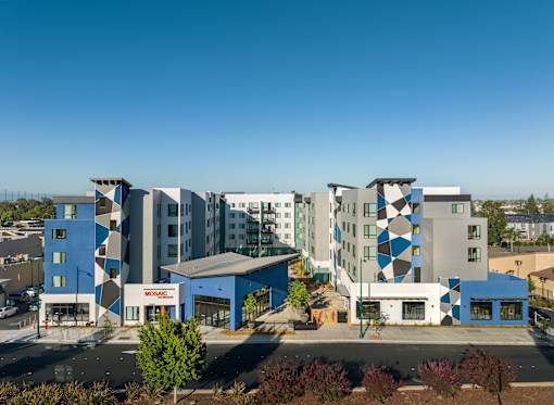 A modern building complex with a blue and white color scheme.