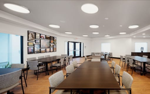 a large dining room with tables and chairs