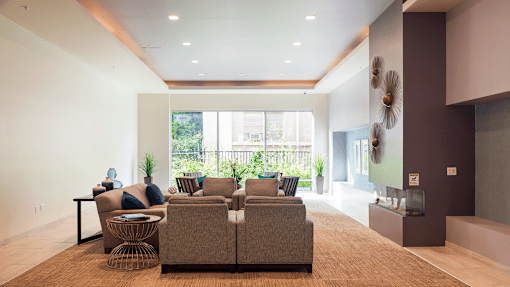 a living room with a couch and a large window