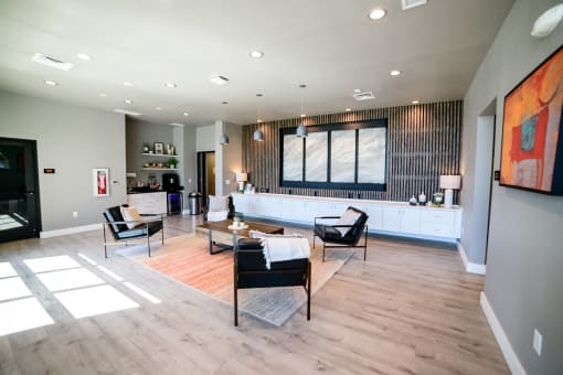 a large living room with a couch and chairs