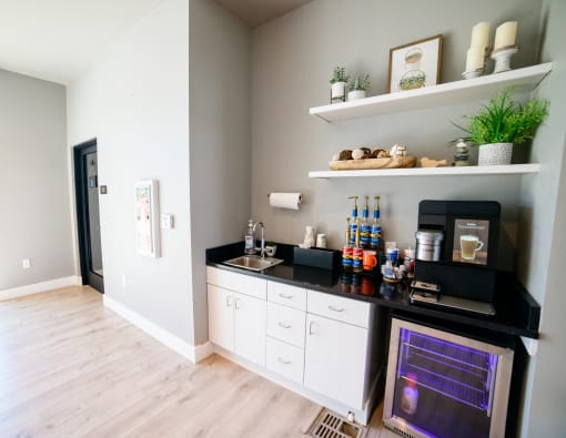 a kitchen with a counter and a sink and a door