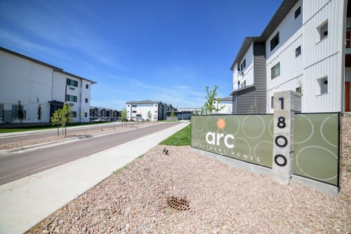 a city street with a sign that reads arc residential homes