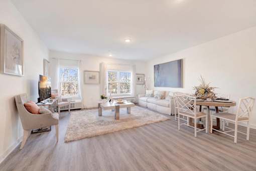 a living room with a couch and a table at The Franklin at Hillsborough Apartments, New Jersey