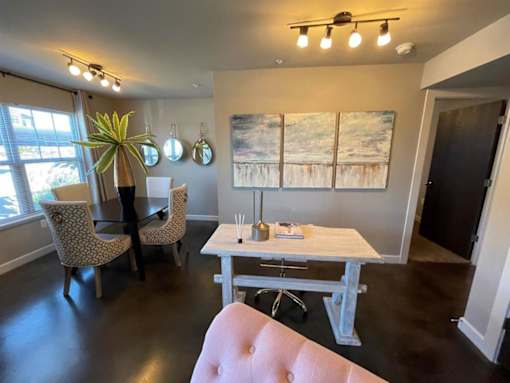 a dining room with a table and chairs