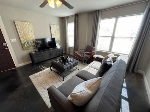 a living room with a couch and a tv