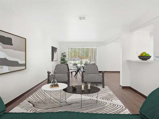 a living room with a table and chairs and a rug