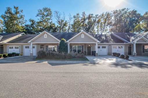 a house with a driveway and a street in front of it