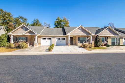 a house with a driveway and a street in front of it