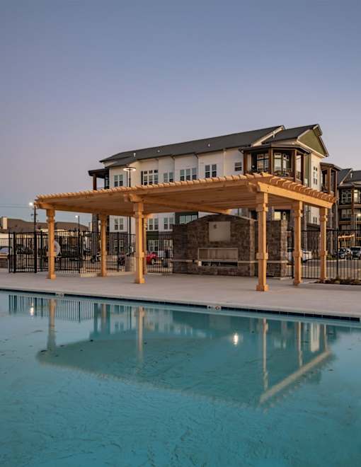 a building with a pool in front of it