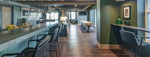 a long bar in a restaurant with chairs
