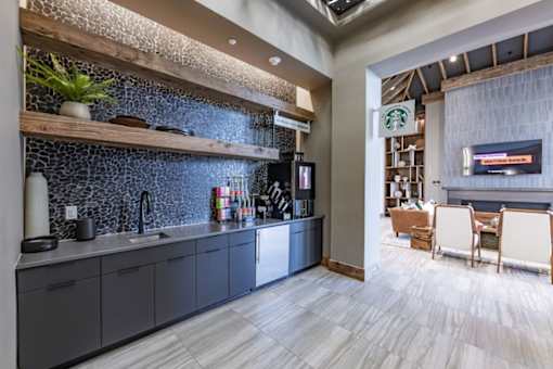 a kitchen and dining area in a hotel room