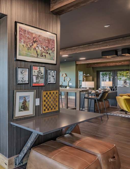 a living room with a table and chairs