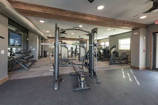 the gym at the flats at big tex apartments