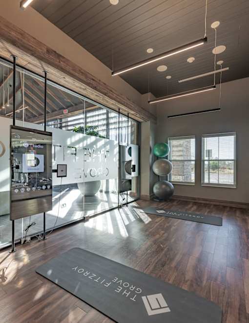 the lobby of a yoga studio with a yoga mat in front of a glass window