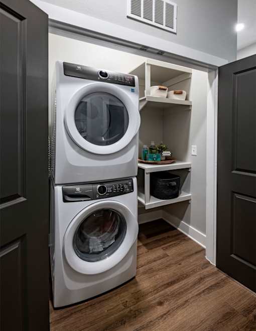 a small laundry room with a washer and dryer