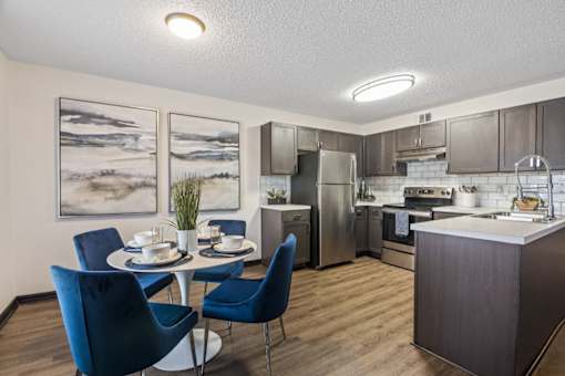 our apartments offer a kitchen and dining room with stainless steel appliances at The Lorient Apartments, Pensacola, FL, 32514