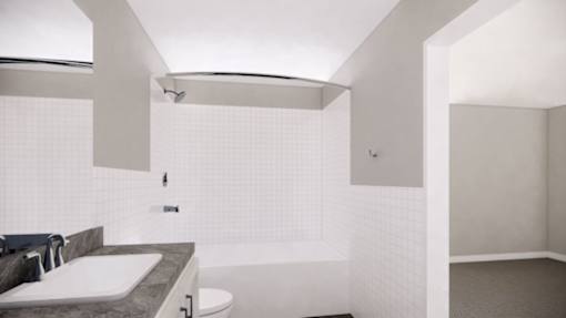 A white bathroom with a sink, toilet and bathtub.
