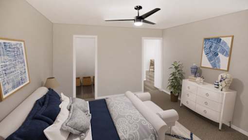 A bedroom with a bed, dresser, and ceiling fan.