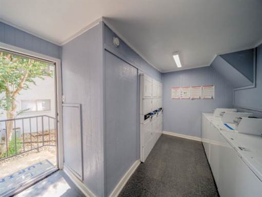 a kitchen with a door to a balcony and a sink at Villas del Tesoro Apartments, Dallas, TX, 75228
