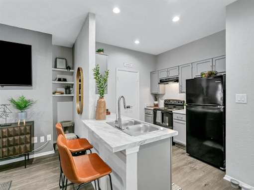 a kitchen with a sink and a counter top